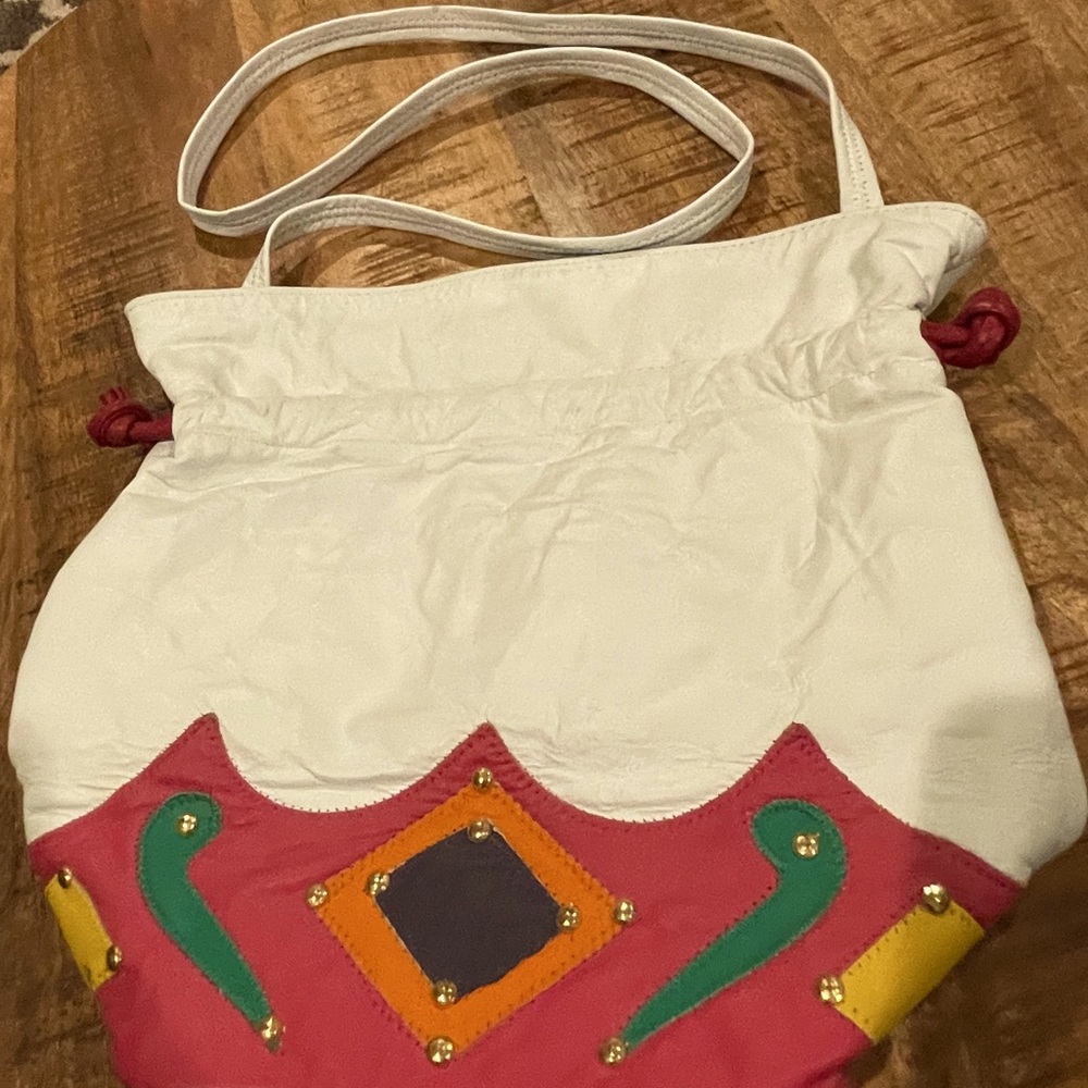 White with pink trim Womens handbag.  Genuine leather.